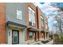 Modern townhomes showcase a harmonious blend of brick and siding, offering contemporary curb appeal at 805 Switchyard Pl, Indianapolis, IN 46202