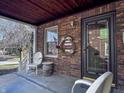 Inviting front porch featuring classic brickwork, seating, and decorative accents at 850 N Butler Ave, Indianapolis, IN 46219