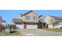 Charming two-story home with a three-car garage and well-maintained front yard at 11624 Eldridge Dr, Indianapolis, IN 46235
