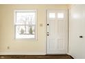 Bright entryway featuring hardwood floors and a view of the outdoors at 14 N Edmondson Ave, Indianapolis, IN 46219