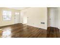 Comfortable living room featuring hardwood floors and neutral colored walls at 14 N Edmondson Ave, Indianapolis, IN 46219