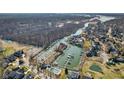 Stunning aerial view showcases a waterfront community with boat docks and serene surroundings at 14870 Starboard Rd, Fishers, IN 46040