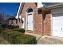 Close-up of the front entrance showing a decorative door and brick facade at 154 Dover N Blvd, Brownsburg, IN 46112
