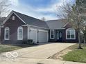 Charming brick home with an attached two car garage and long driveway at 1808 Turning Leaf Dr, Franklin, IN 46131