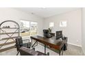 Modern home office with stylish dark wood desk, comfortable seating, and ample natural light at 192 Lynnette Way, Indianapolis, IN 46229