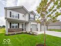 Beautiful two-story house with a well-maintained lawn, brick accents, and a three-car garage at 2290 Oakmont Dr, Plainfield, IN 46168