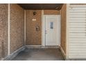 Covered front entrance with white door, exterior light, and mailbox at 3655 Yellow Poplar Ct, Indianapolis, IN 46222