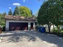 Spacious two-car garage and driveway providing ample parking and storage options at 5515 Shorewood Dr, Indianapolis, IN 46220