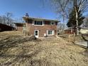 View of backyard with a door leading into the brick home and a patio area at 5850 Paradise Ln, Martinsville, IN 46151