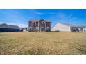 Expansive backyard with a well-maintained lawn, offering ample space for outdoor activities and relaxation at 6699 Dunkirk Dr, McCordsville, IN 46055