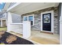 Inviting front porch with stone accents, white railings, and a welcoming front door at 856 Parker Ln, Westfield, IN 46074