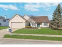 Charming single-story home with a well-manicured lawn, attached garage, and inviting curb appeal at 9930 Chinquapin Ct, Carmel, IN 46033