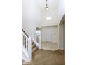 Bright foyer with tile flooring, stairs, and a high ceiling with lots of natural light at 12683 Raiders Blvd, Fishers, IN 46037