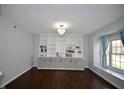 Charming living room with built-in cabinets and large window at 13509 Dunes Dr, Carmel, IN 46032
