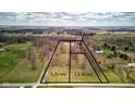 Aerial view of acreage showing the property divided into 1.5, 3.5, and 5 acre sections with mature trees at 15123 E 196Th St, Noblesville, IN 46060
