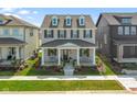 Beautifully landscaped front yard leading to a charming two-story home with a welcoming front porch at 15304 Fairlands Dr, Westfield, IN 46074