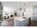 Modern kitchen featuring granite countertops, stainless steel appliances, and an open view of the dining area at 15304 Fairlands Dr, Westfield, IN 46074
