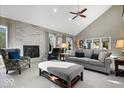 Bright living room with vaulted ceiling, fireplace, and neutral décor at 1621 Rosebud Ln, Greenwood, IN 46143