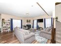 Comfortable living room with a fireplace, large windows, and stylish furniture at 16406 Taconite Dr, Noblesville, IN 46060