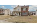 Charming two-story home with a welcoming front porch and well-maintained lawn in a residential neighborhood at 17953 Forreston Oak Dr, Noblesville, IN 46062