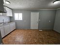 The kitchen includes white cabinets and a tiled floor at 3044 Manor Ct, Indianapolis, IN 46218