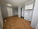 The kitchen includes white cabinets and a tiled floor at 3044 Manor Ct, Indianapolis, IN 46218
