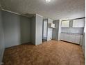 The kitchen includes white cabinets and a tiled floor at 3044 Manor Ct, Indianapolis, IN 46218
