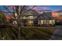 Stunning two-story home featuring a beautiful wrap-around porch and lush lawn at 3608 Olive Branch Rd, Greenwood, IN 46143