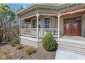 Charming front porch showcasing intricate woodwork and a beautiful double-door entrance at 3608 Olive Branch Rd, Greenwood, IN 46143