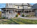 Inviting front porch with detailed trim work, creating a warm and welcoming entrance at 3608 Olive Branch Rd, Greenwood, IN 46143