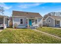Lovely home with a blue door and a neat front yard at 4529 Norwaldo Ave, Indianapolis, IN 46205