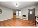 Inviting living room with hardwood floors, a large window, and neutral wall colors at 515 N Odell St, Brownsburg, IN 46112