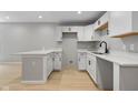 Updated kitchen showcasing white cabinetry, modern countertops, and stainless steel faucet at 516 N Chester Ave, Indianapolis, IN 46201