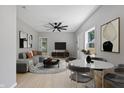 Open-concept living and dining area featuring modern furnishings and light, neutral tones at 516 N Chester Ave, Indianapolis, IN 46201