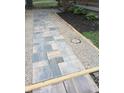 Paver walkway leading to the home's entrance, bordered by decorative gravel and mulch at 5603 S Randolph St, Indianapolis, IN 46227