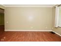Spacious living room with wood-look flooring, neutral walls and natural light at 5909 Furnas Rd, Indianapolis, IN 46221