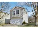 Charming two-story home featuring a two-car garage and well-maintained landscaping at 6663 Black Antler Cir, Indianapolis, IN 46217