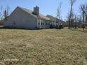Private backyard featuring a well-kept lawn and a deck, ideal for outdoor gatherings at 720 Erin Dr, Avon, IN 46123