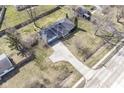Expansive aerial view showcasing the home, driveway, and surrounding landscaped yard at 7401 E 56Th St, Indianapolis, IN 46226