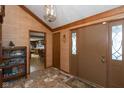 Home entryway with tiled floors and view into the kitchen at 8331 Lookout Ct, Indianapolis, IN 46217