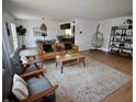 Open concept living room showcasing modern furniture, stylish décor, and seamless flow into dining area at 8417 Castle Ridge Ln, Indianapolis, IN 46256