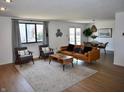Bright living room with modern furniture, a large window, and stylish decor for comfortable living at 8417 Castle Ridge Ln, Indianapolis, IN 46256