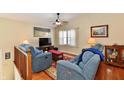 Cozy living room with ceiling fan, comfortable blue couches, and stylish decor providing a relaxing atmosphere at 9235 Doubloon Rd, Indianapolis, IN 46268