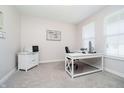 Bright office space with neutral carpet, natural light, and a white writing desk at 11180 Jubilation Way, Noblesville, IN 46060