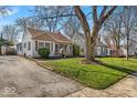 Well-kept home with a green lawn and mature trees, set in a quiet residential area at 2603 E 58Th St, Indianapolis, IN 46220