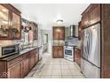 Spacious kitchen with granite countertops, stainless steel appliances, and tile flooring at 2603 E 58Th St, Indianapolis, IN 46220