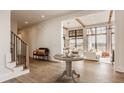 Open concept foyer with hardwood flooring leads to a living room bathed in natural light at 3787 Cherwell Dr, Zionsville, IN 46077