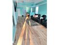 This spacious living room offers wood floors, modern lighting, and comfortable seating, with modern decor at 424 S Parker Ave, Indianapolis, IN 46201