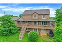 Two story home with a spacious deck and lush greenery around the property at 4590 Turkey Track Rd, Martinsville, IN 46151