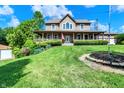 Charming two-story home with manicured lawn and covered front porch at 4590 Turkey Track Rd, Martinsville, IN 46151